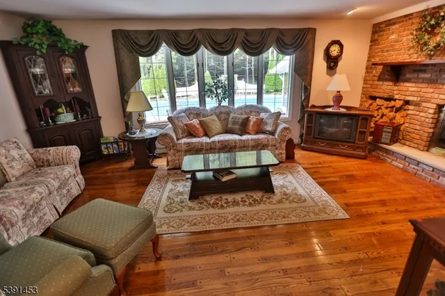 a living room with furniture rug and window