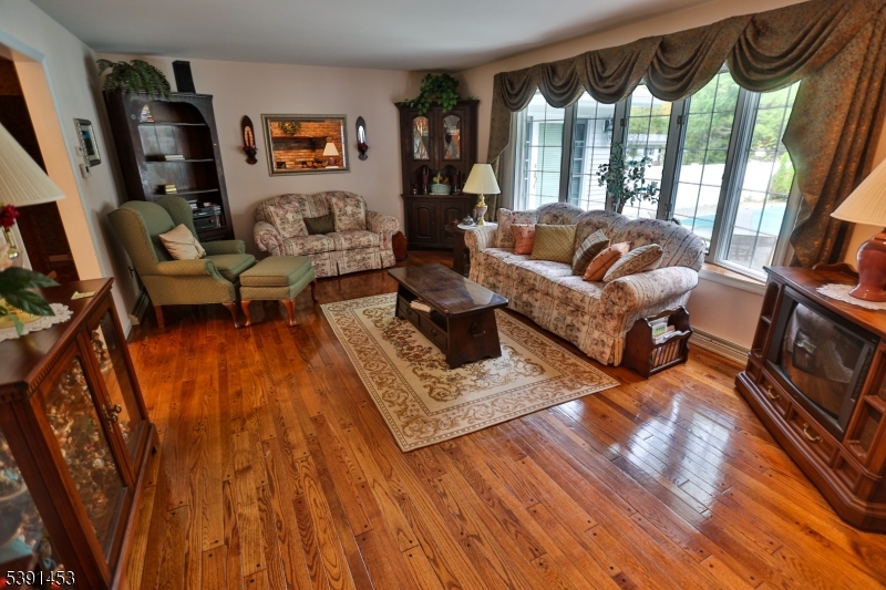 47 New Mashipacong Road Montague, NJ 07827 - Photo 10 of 42 a living room with furniture and a floor to ceiling window