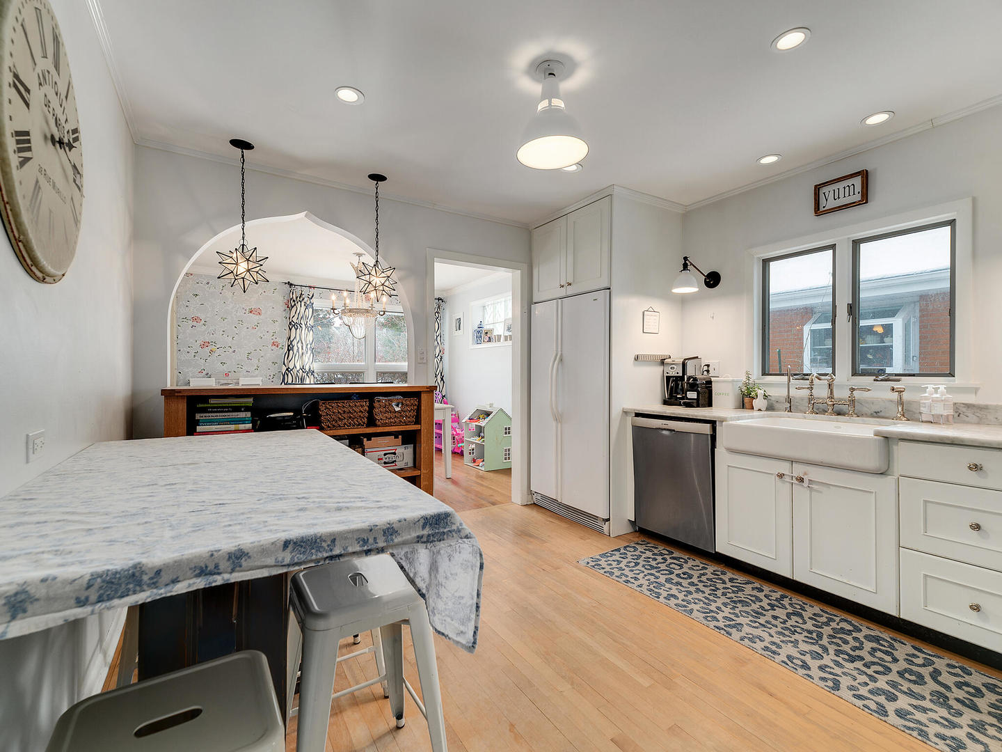 1340 Oak Street Western Springs, IL 60558 - Photo 12 of 25 a kitchen with granite countertop a table chairs stove and wooden floor