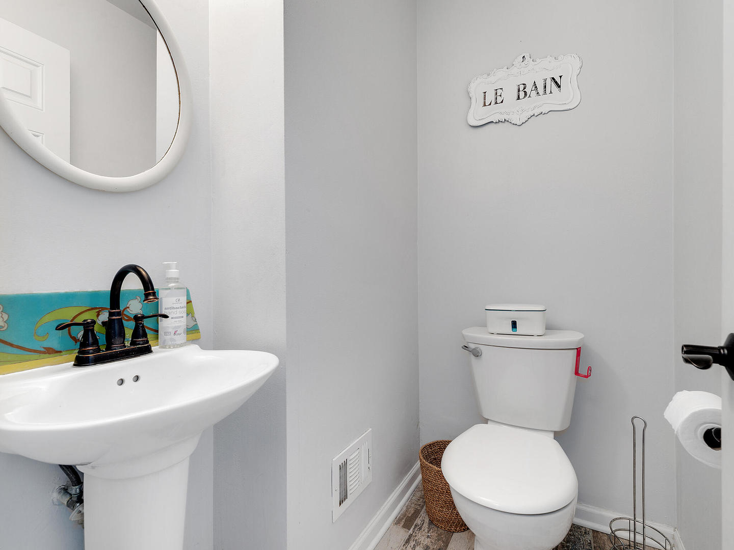 1340 Oak Street Western Springs, IL 60558 - Photo 23 of 25 a bathroom with a toilet a sink and mirror