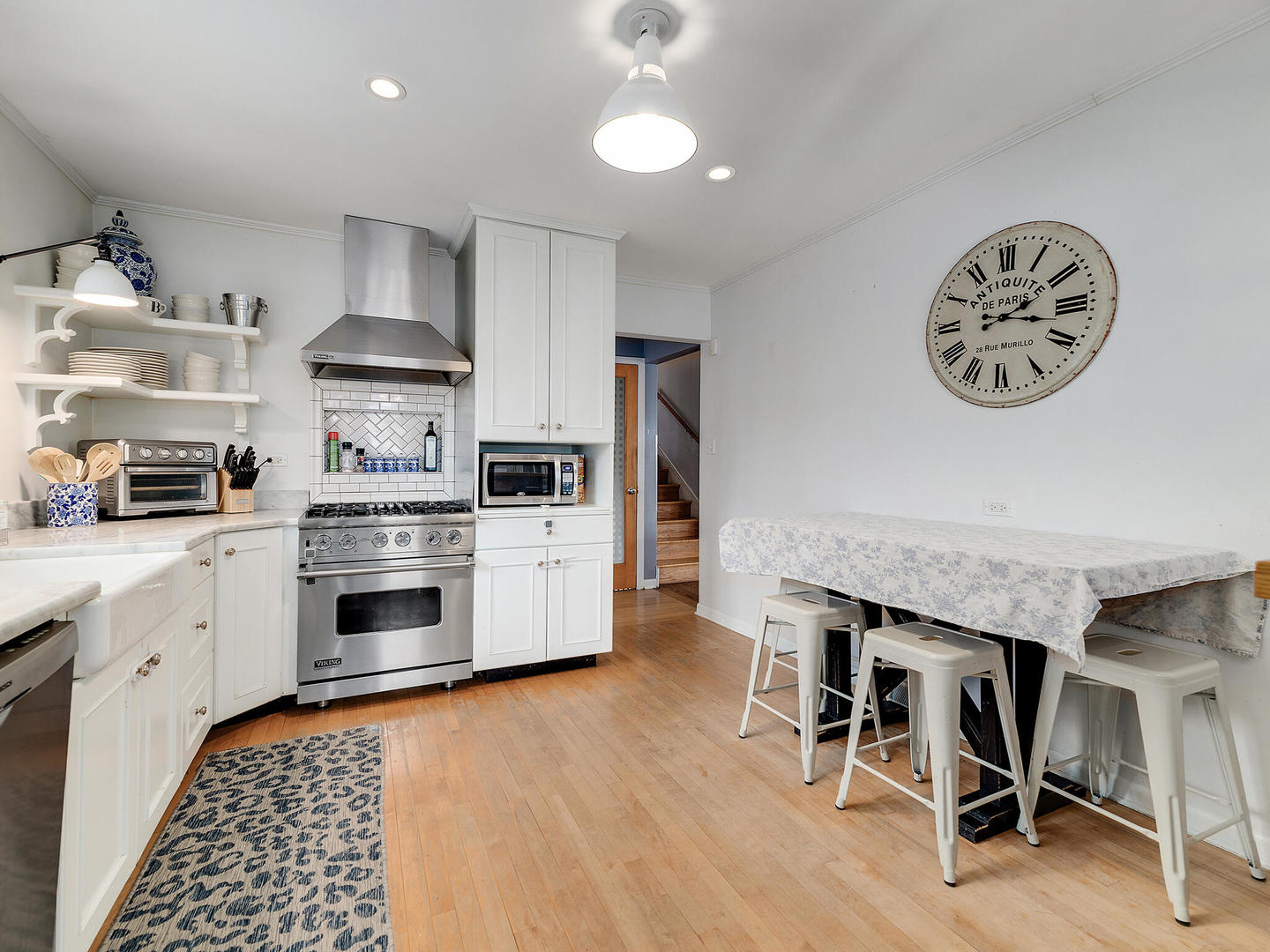 1340 Oak Street Western Springs, IL 60558 - Photo 10 of 25 a kitchen with granite countertop a stove a sink and a refrigerator