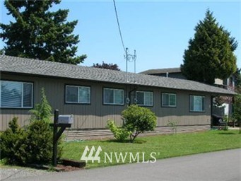 666 Index Place Northeast Renton, WA 98056 - Photo 1 of 11 a front view of a house with a garden