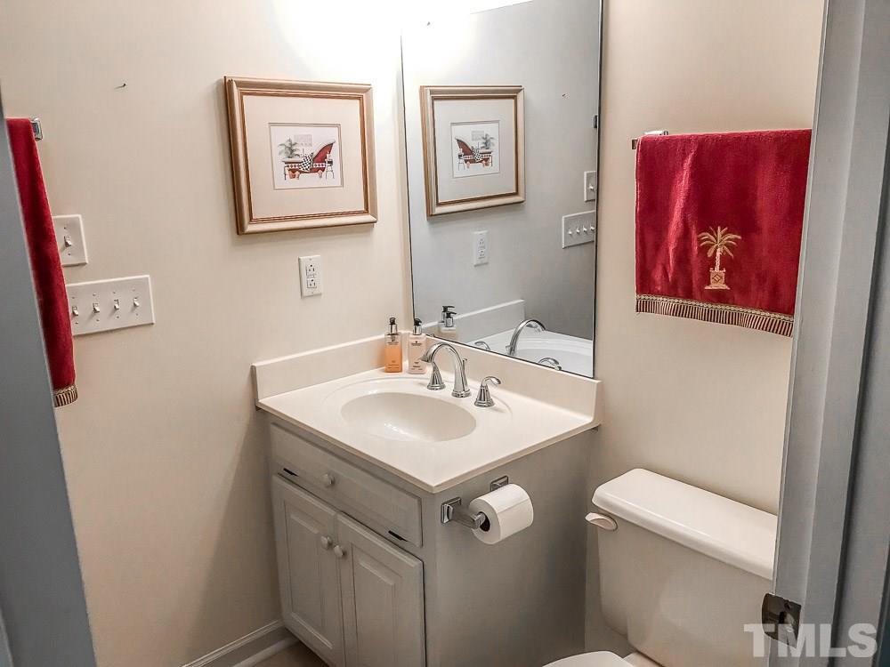 6407 Craig Road Durham, NC 27712 - Photo 14 of 25 The Powder Room is just down the hallway from the Kitchen.