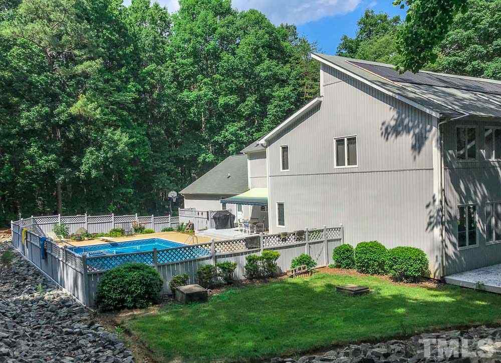 6407 Craig Road Durham, NC 27712 - Photo 3 of 25 40 x 20 Pool with privacy fence, 57 x 34 pool patio and extra 27 x 10 raised deck and awning.