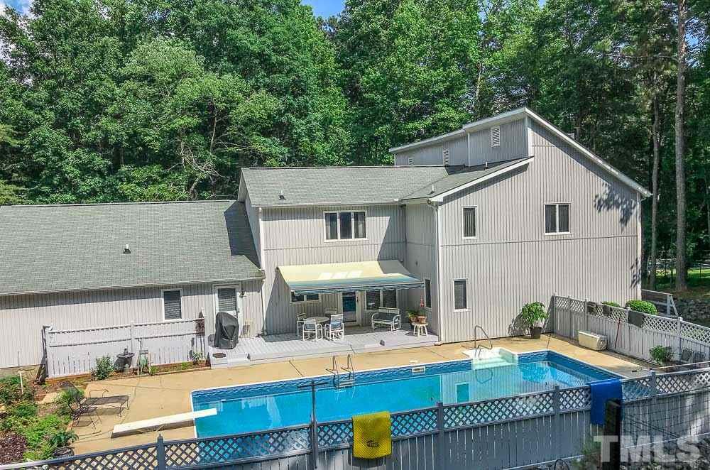 6407 Craig Road Durham, NC 27712 - Photo 4 of 25 Solar Heated Pool is ready for you!! Deck is 57' x 34'. Sunsetter Electric Awning opens in 60 seconds. Raised Deck under awning area is 27' x 10'.