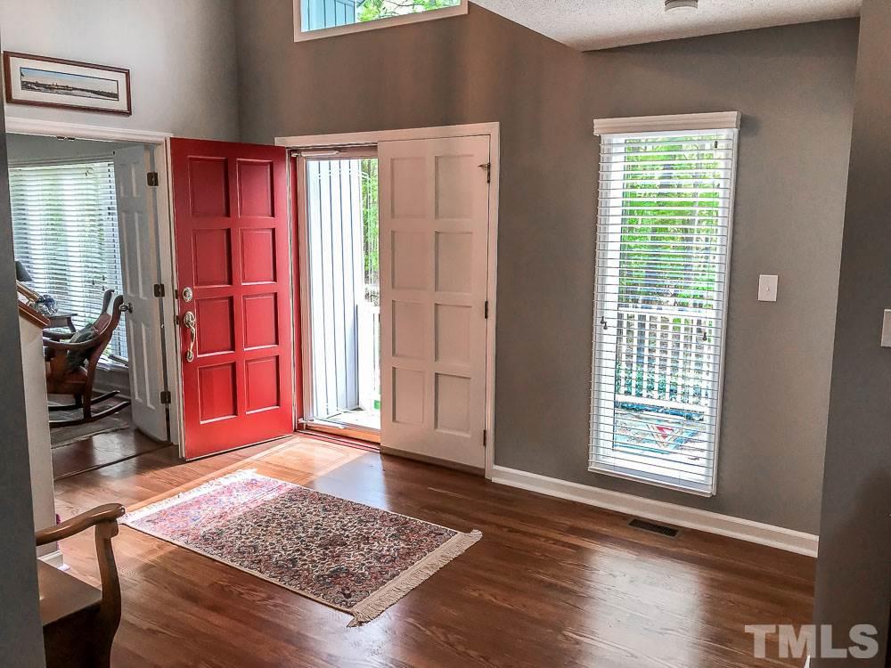 6407 Craig Road Durham, NC 27712 - Photo 7 of 25 Open and airy Entry area has access to Formal Living Room through door way shown on left. The stairway to the second floor is straight in front of the open door.