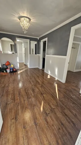 a view of a livingroom with furniture and chandelier