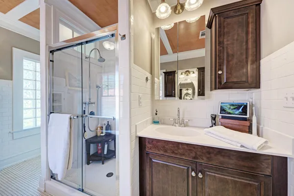 a bathroom with a sink and a mirror