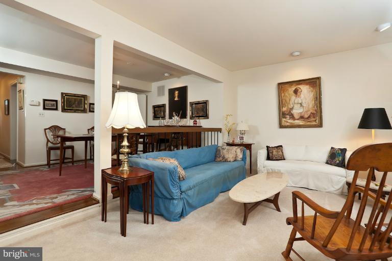 6617 Weymouth Road Baltimore, MD 21212 - Photo 12 of 30 a living room with furniture a fireplace and a table