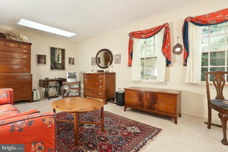 6617 Weymouth Road Baltimore, MD 21212 - Photo 15 of 30 a living room with furniture a rug and a window