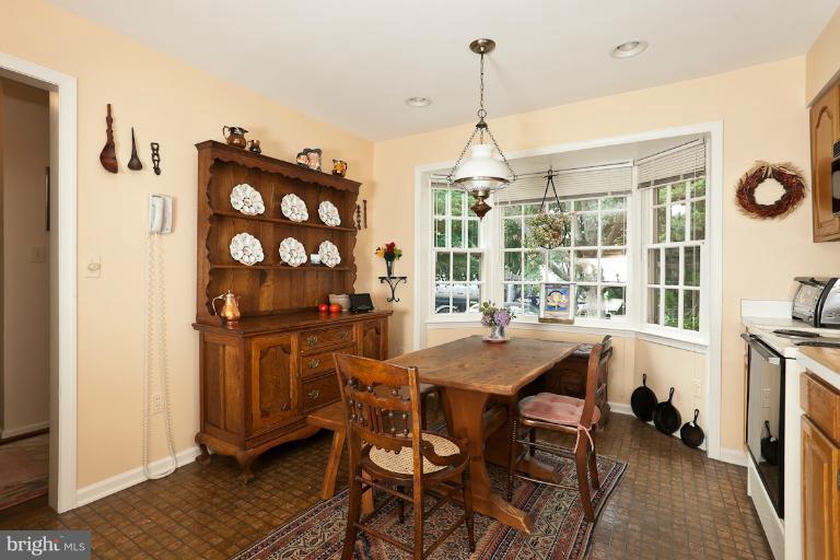6617 Weymouth Road Baltimore, MD 21212 - Photo 24 of 30 a view of a dining room with furniture window and wooden floor