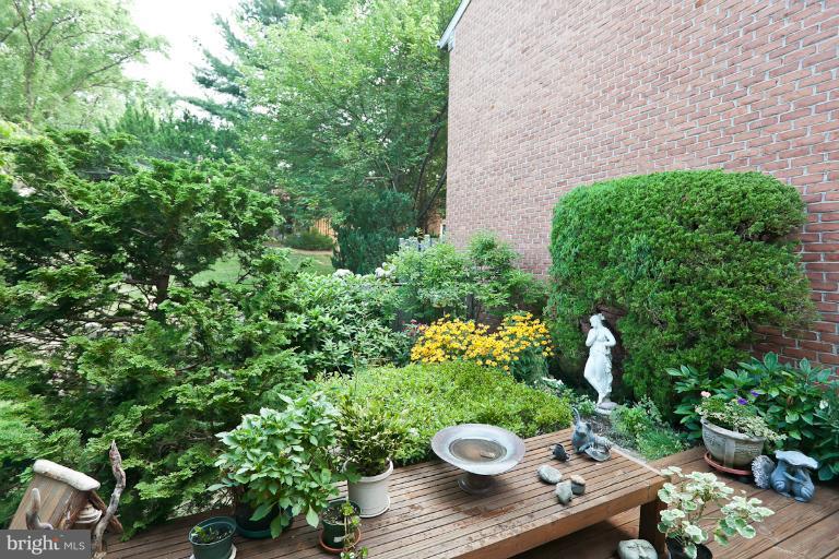 6617 Weymouth Road Baltimore, MD 21212 - Photo 8 of 30 a view of a table and chairs and potted plants