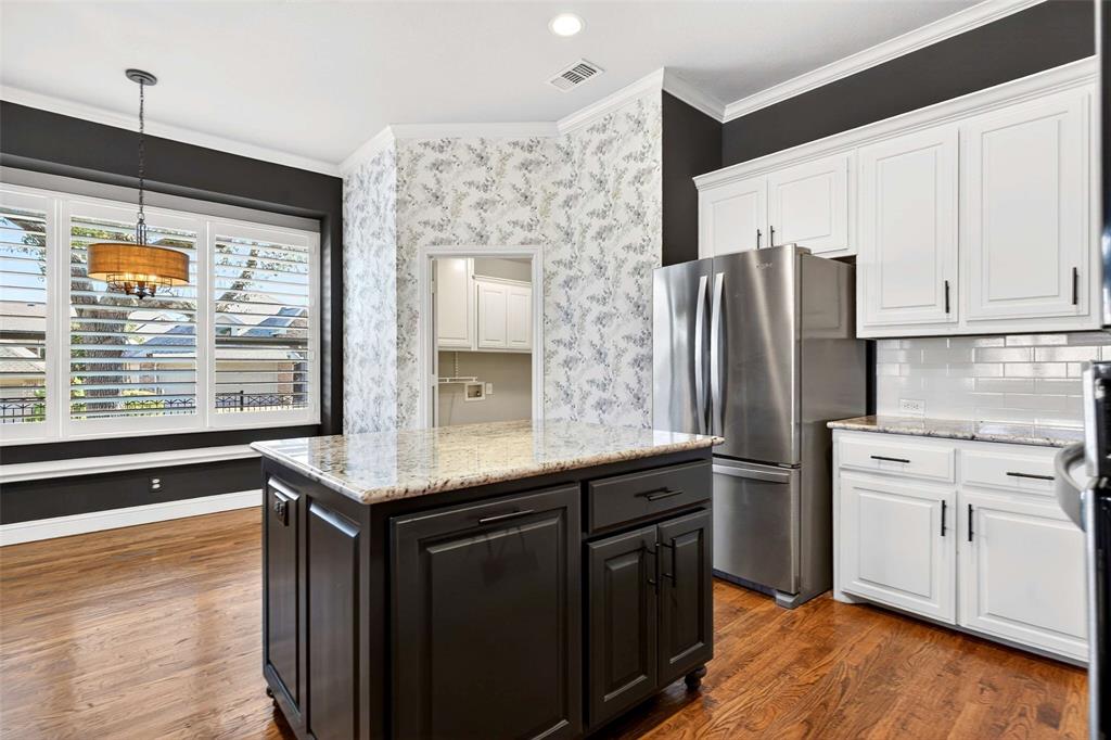 704 Scenic Ranch Circle Fairview, TX 75069 - Photo 14 of 40 a kitchen with stainless steel appliances granite countertop a refrigerator and a sink