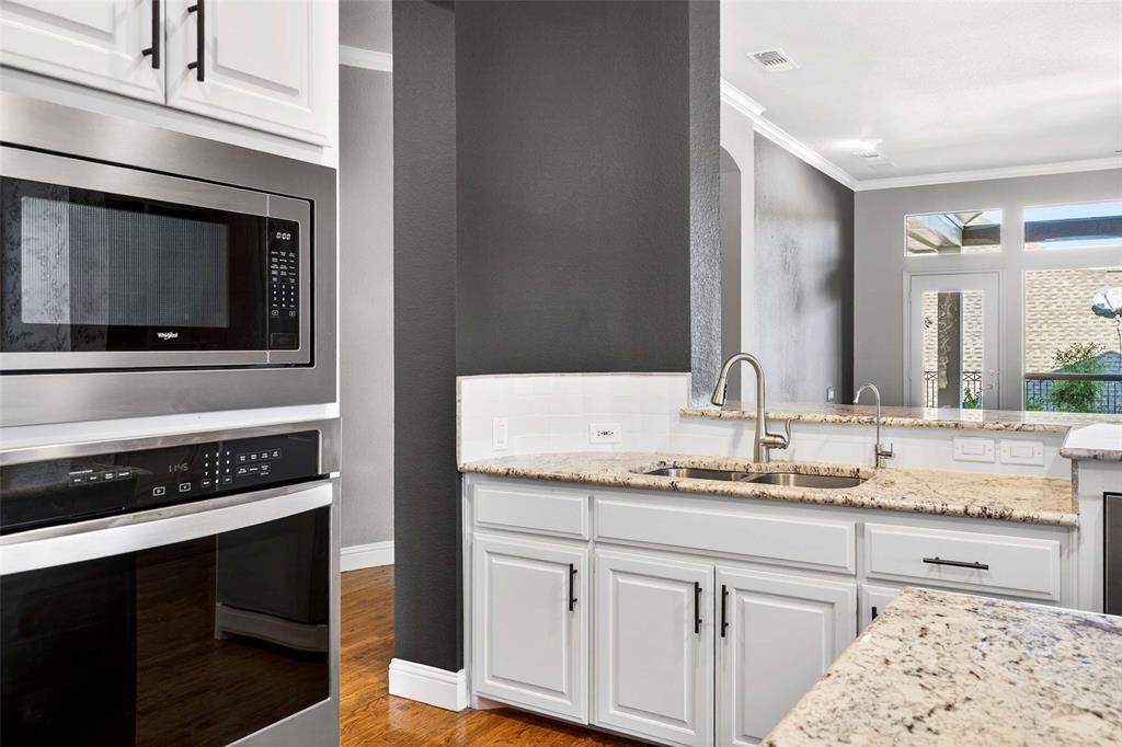 704 Scenic Ranch Circle Fairview, TX 75069 - Photo 17 of 40 a bathroom with a sink and a mirror