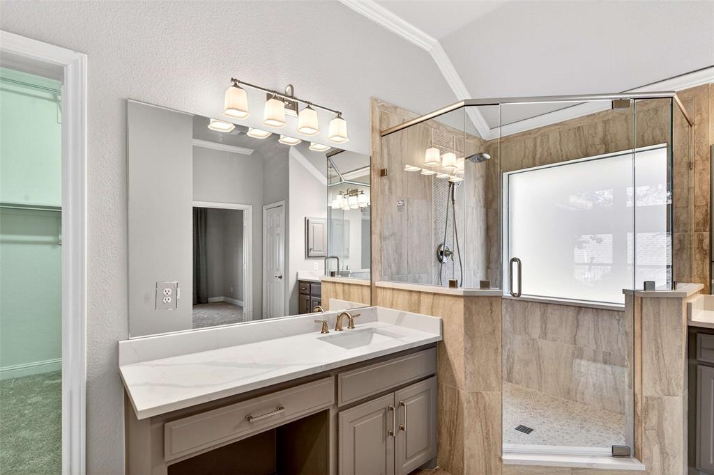 704 Scenic Ranch Circle Fairview, TX 75069 - Photo 25 of 40 a bathroom with a sink vanity granite and a mirror