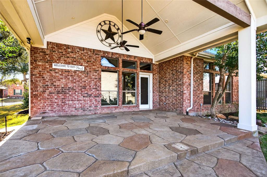 704 Scenic Ranch Circle Fairview, TX 75069 - Photo 30 of 40 a view of a brick house with a large window