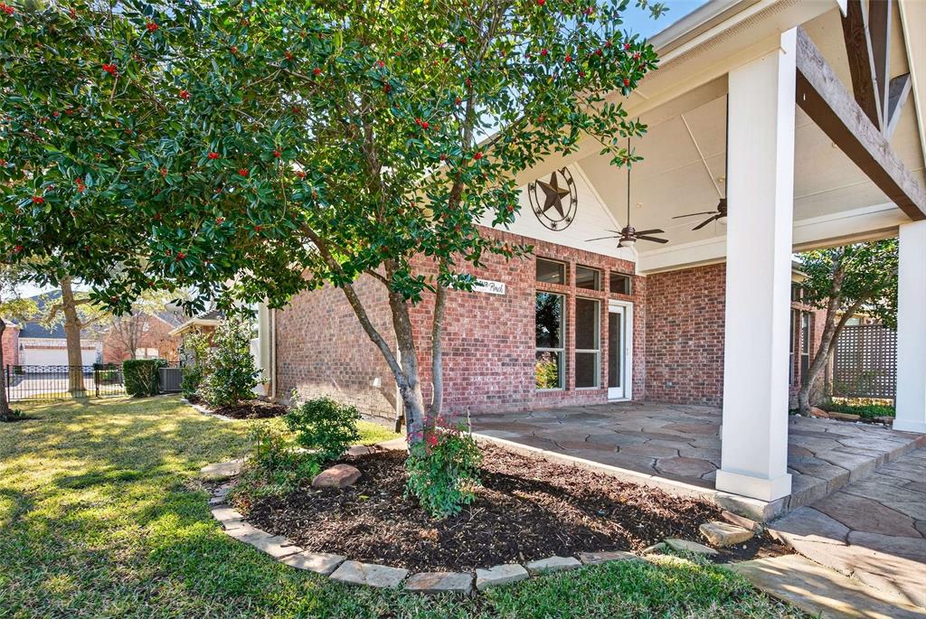 704 Scenic Ranch Circle Fairview, TX 75069 - Photo 33 of 40 a front view of a house with garden