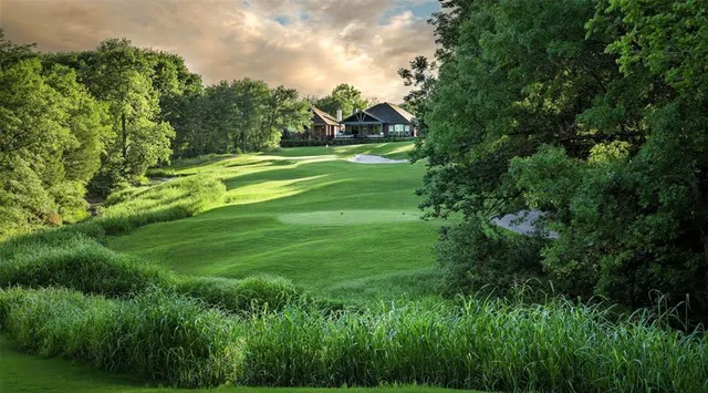 a view of a golf course with a lake