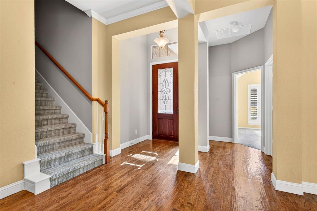 704 Scenic Ranch Circle Fairview, TX 75069 - Photo 4 of 40 a view of an entryway with wooden floor