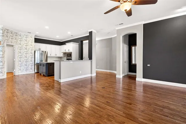 a view of a kitchen with a sink and microwave