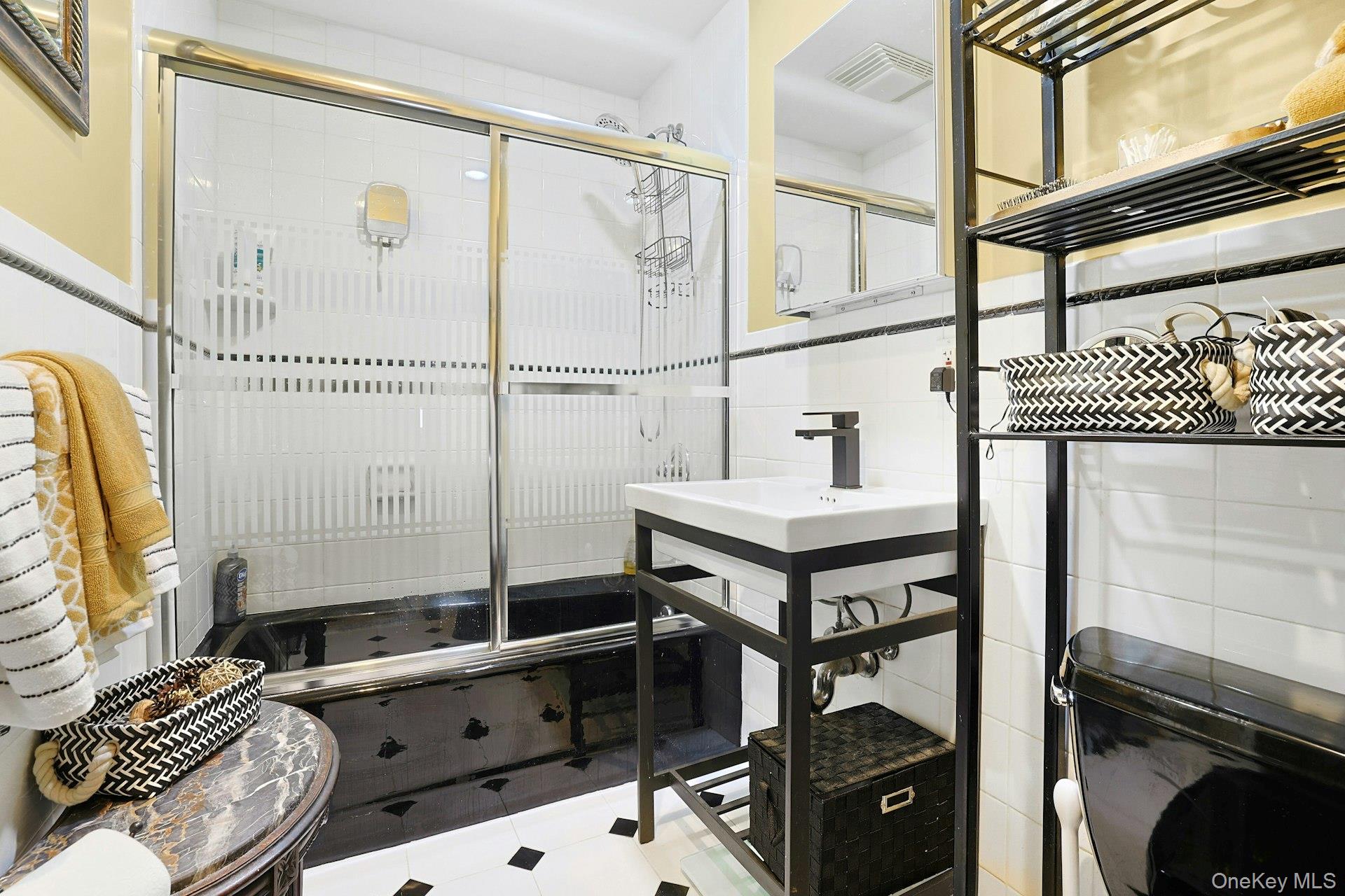 39 Neptune Avenue New Rochelle, NY 10805 - Photo 11 of 28 a bathroom with a sink and a mirror