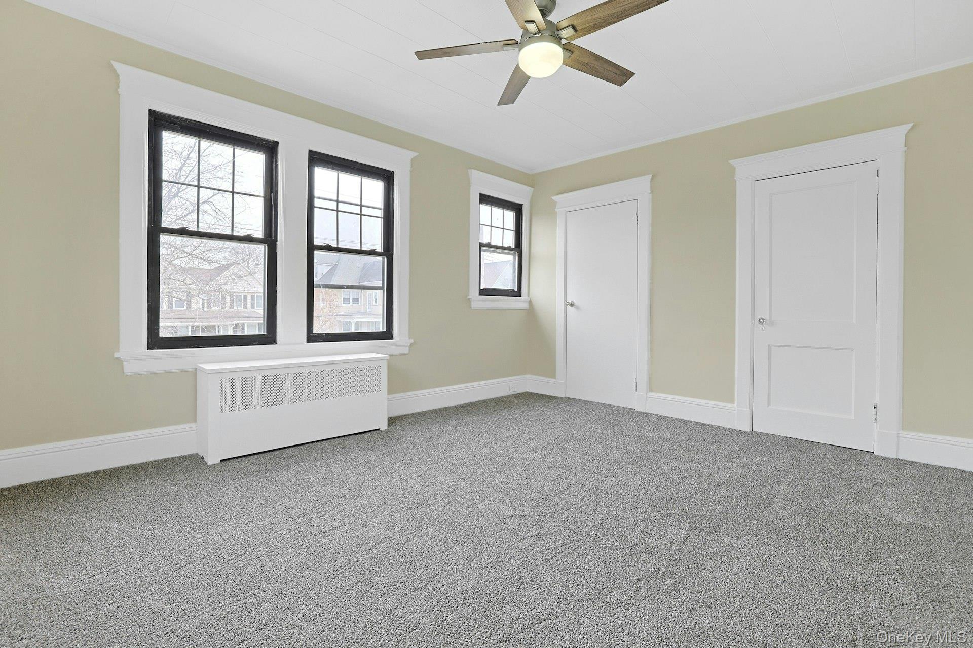 39 Neptune Avenue New Rochelle, NY 10805 - Photo 19 of 28 a view of an empty room with a window