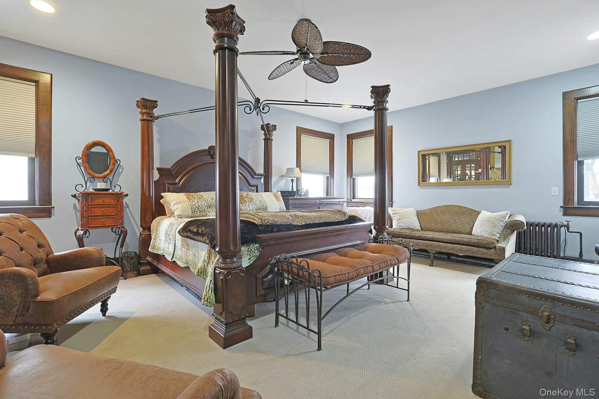 39 Neptune Avenue New Rochelle, NY 10805 - Photo 8 of 28 a living room with furniture gym equipment and a large window