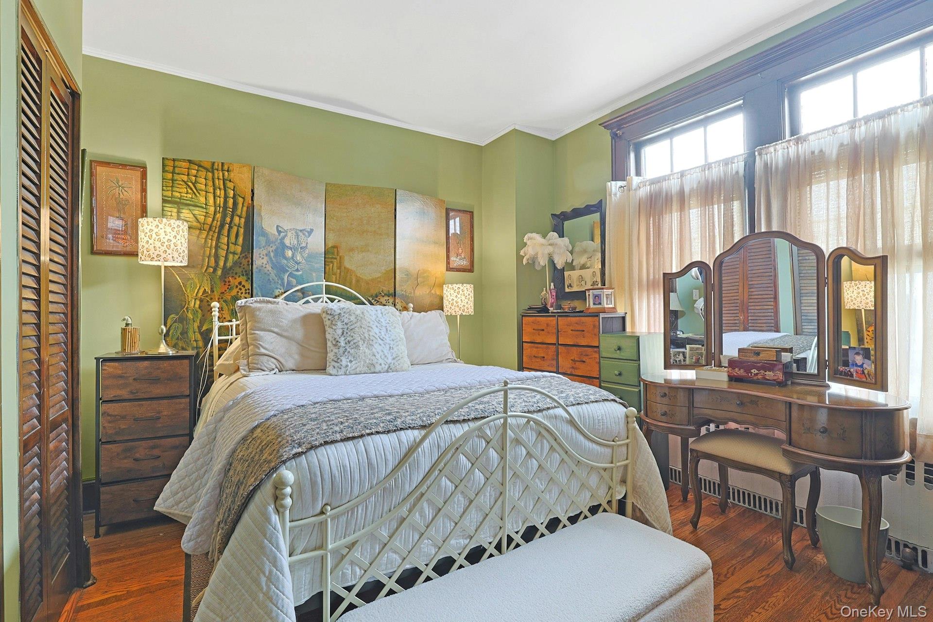 39 Neptune Avenue New Rochelle, NY 10805 - Photo 9 of 28 a bedroom with a bed and large windows