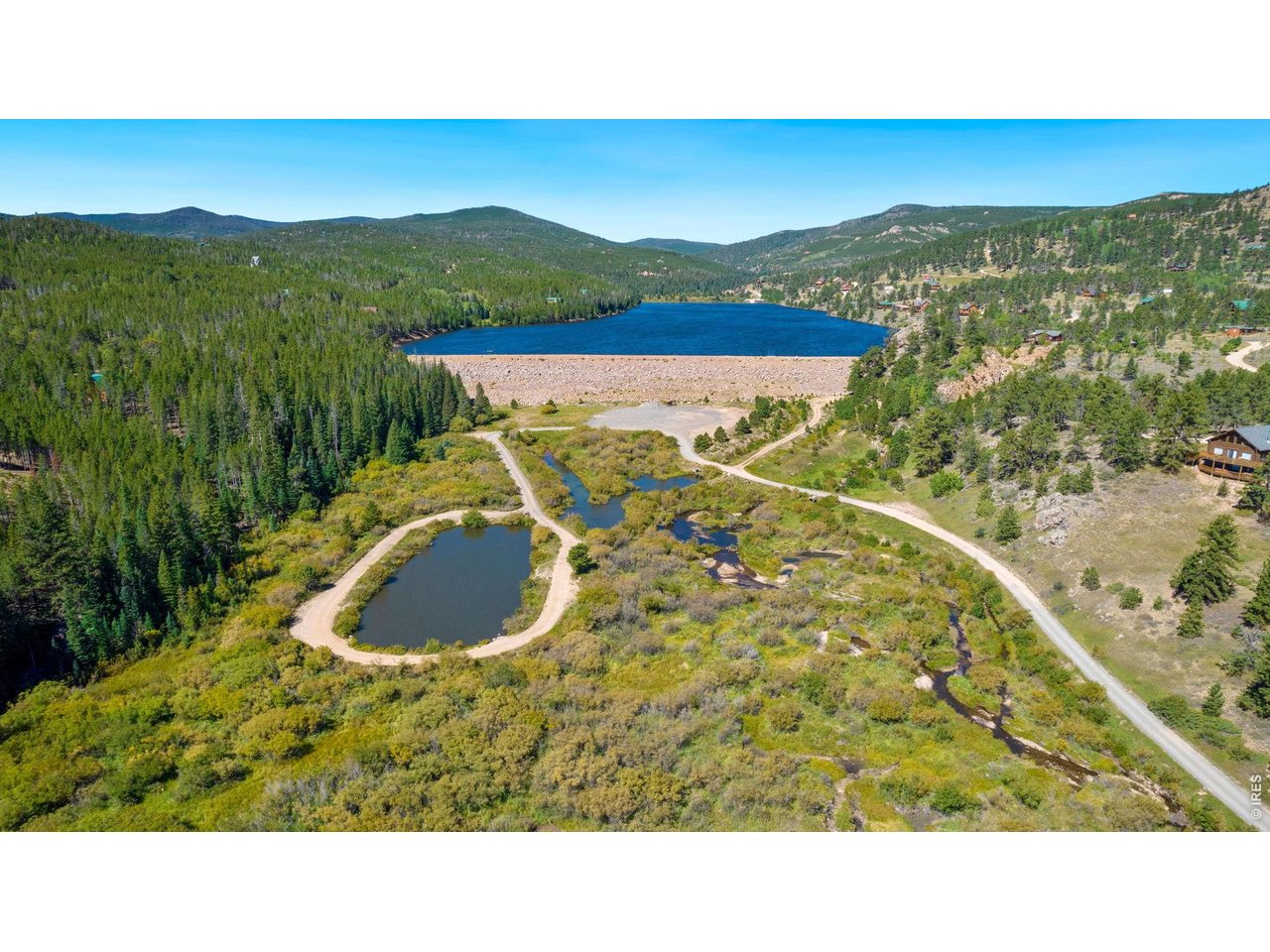34 Shawnee Road Red Feather Lakes, CO 80545 - Photo 26 of 31 Crystal Lake & Snoopy Pond in the foreground.