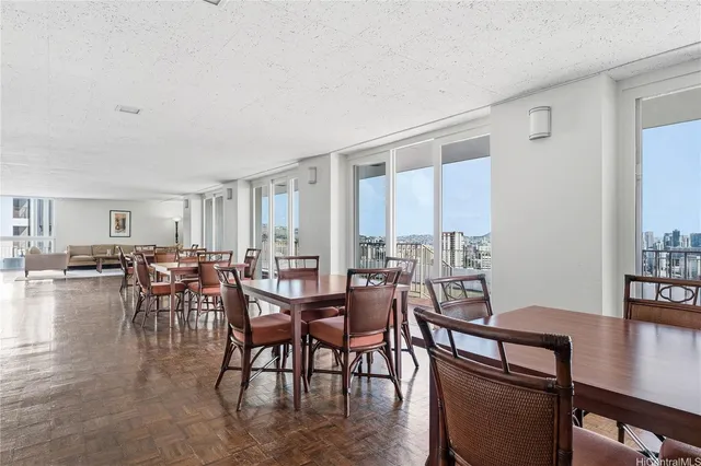 a view of a dining room with furniture and wooden floor