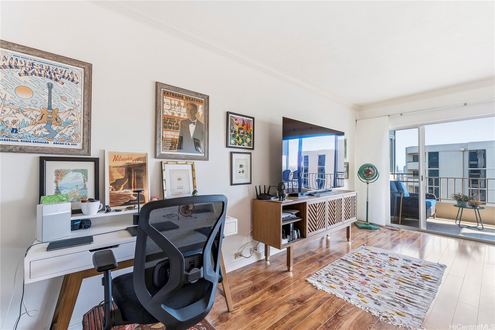 1001 Wilder Avenue, Unit 602 Honolulu, HI 96822 - Photo 3 of 22 a view of a livingroom with furniture window and wooden floor