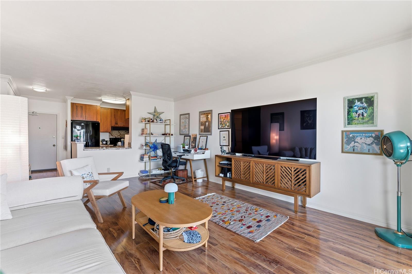 1001 Wilder Avenue, Unit 602 Honolulu, HI 96822 - Photo 5 of 22 a living room with furniture and a flat screen tv