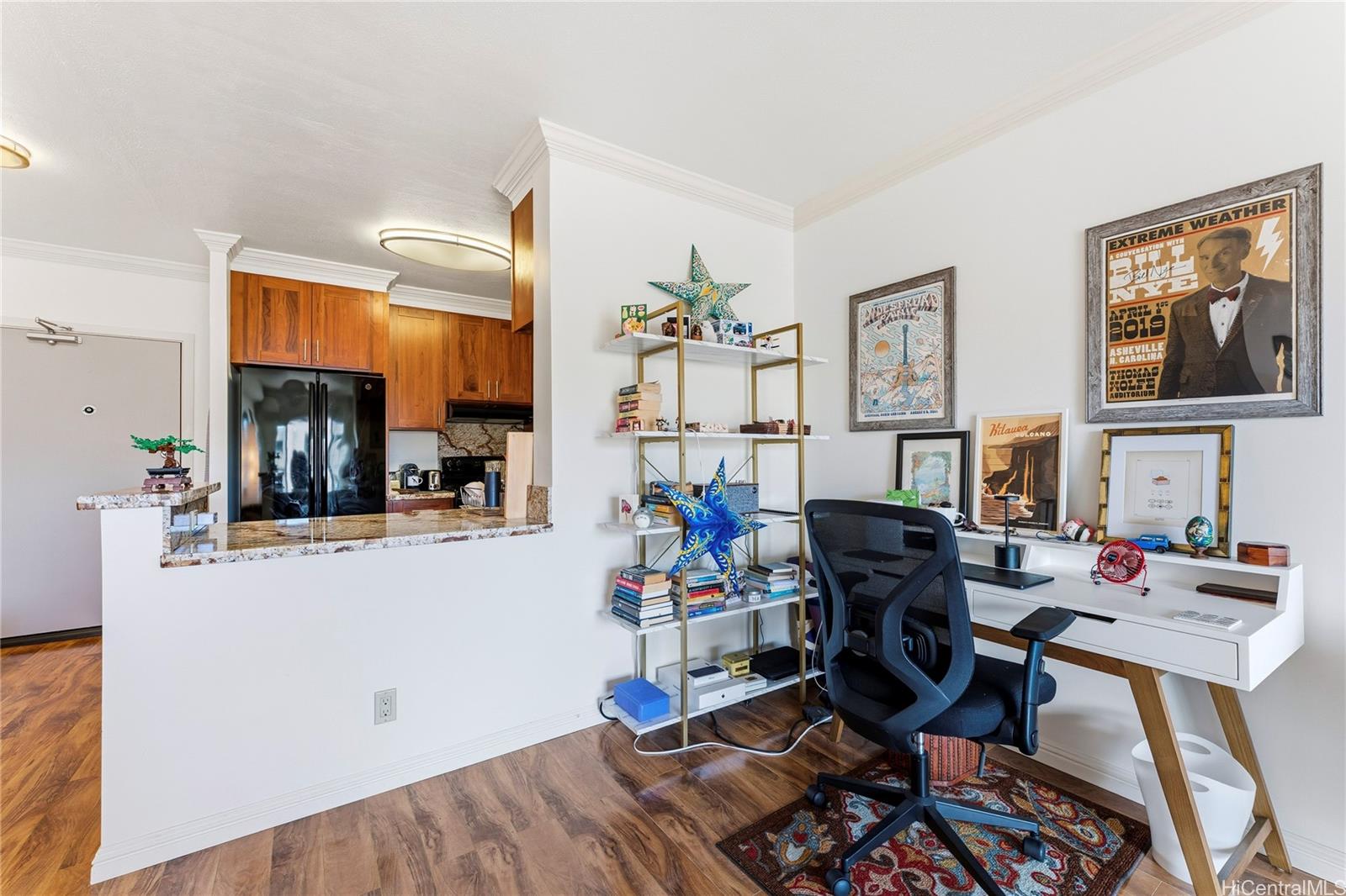 1001 Wilder Avenue, Unit 602 Honolulu, HI 96822 - Photo 6 of 22 a living room with furniture and wooden floor