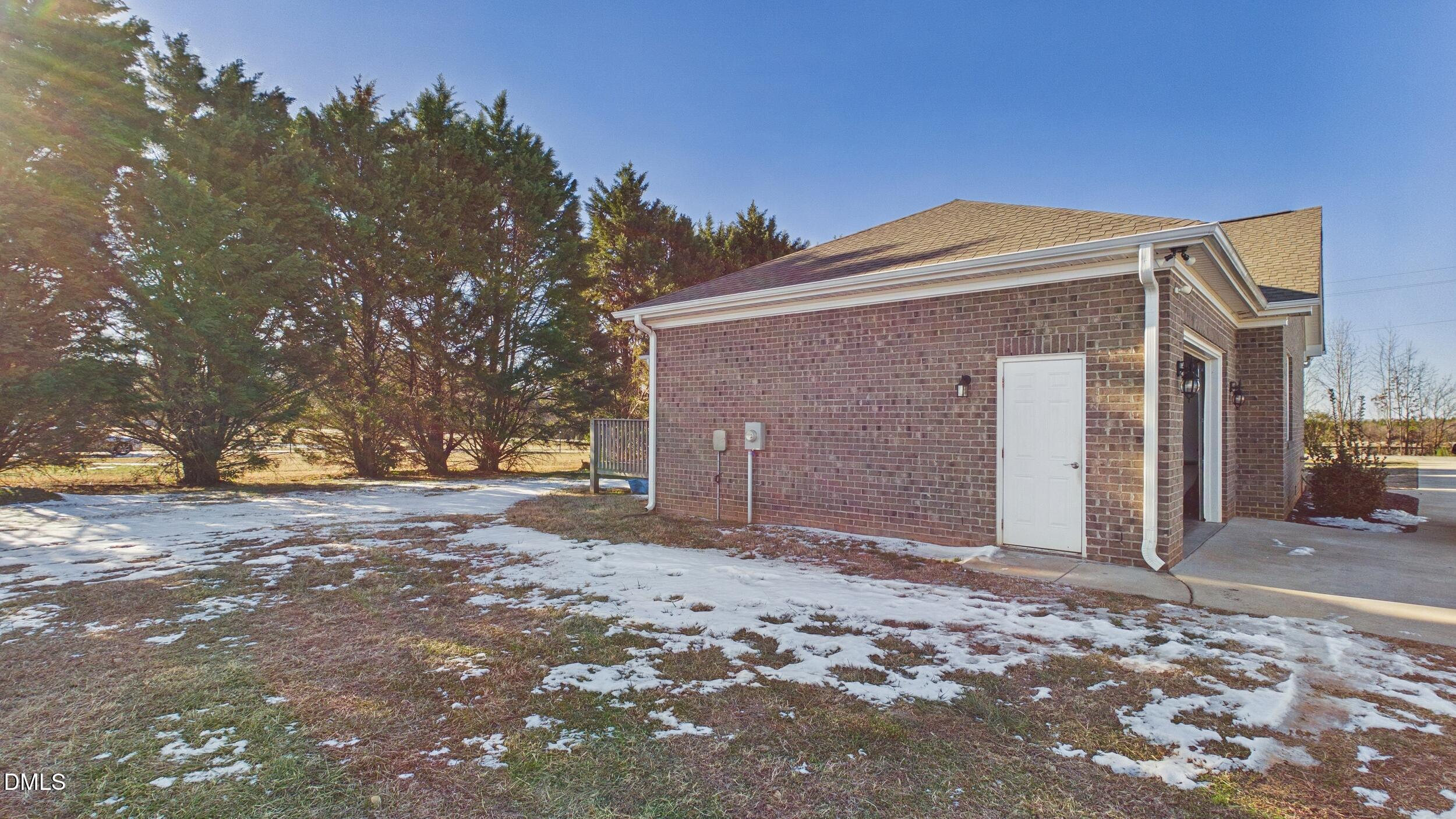 5930 Old 421 Road Liberty, NC 27298 - Photo 33 of 42 a front view of a house with a yard