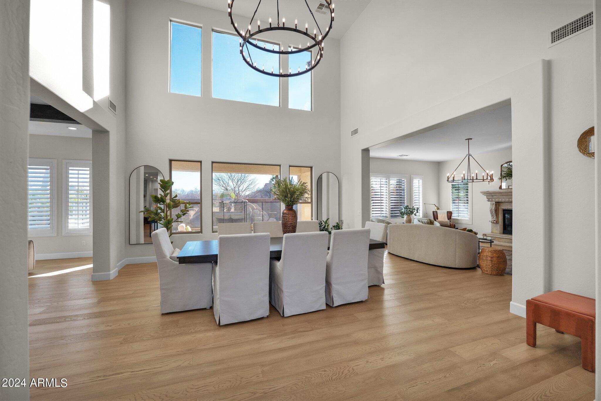2517 South Constellation Way Gilbert, AZ 85295 - Photo 20 of 105 a living room with couches and kitchen view with wooden floor