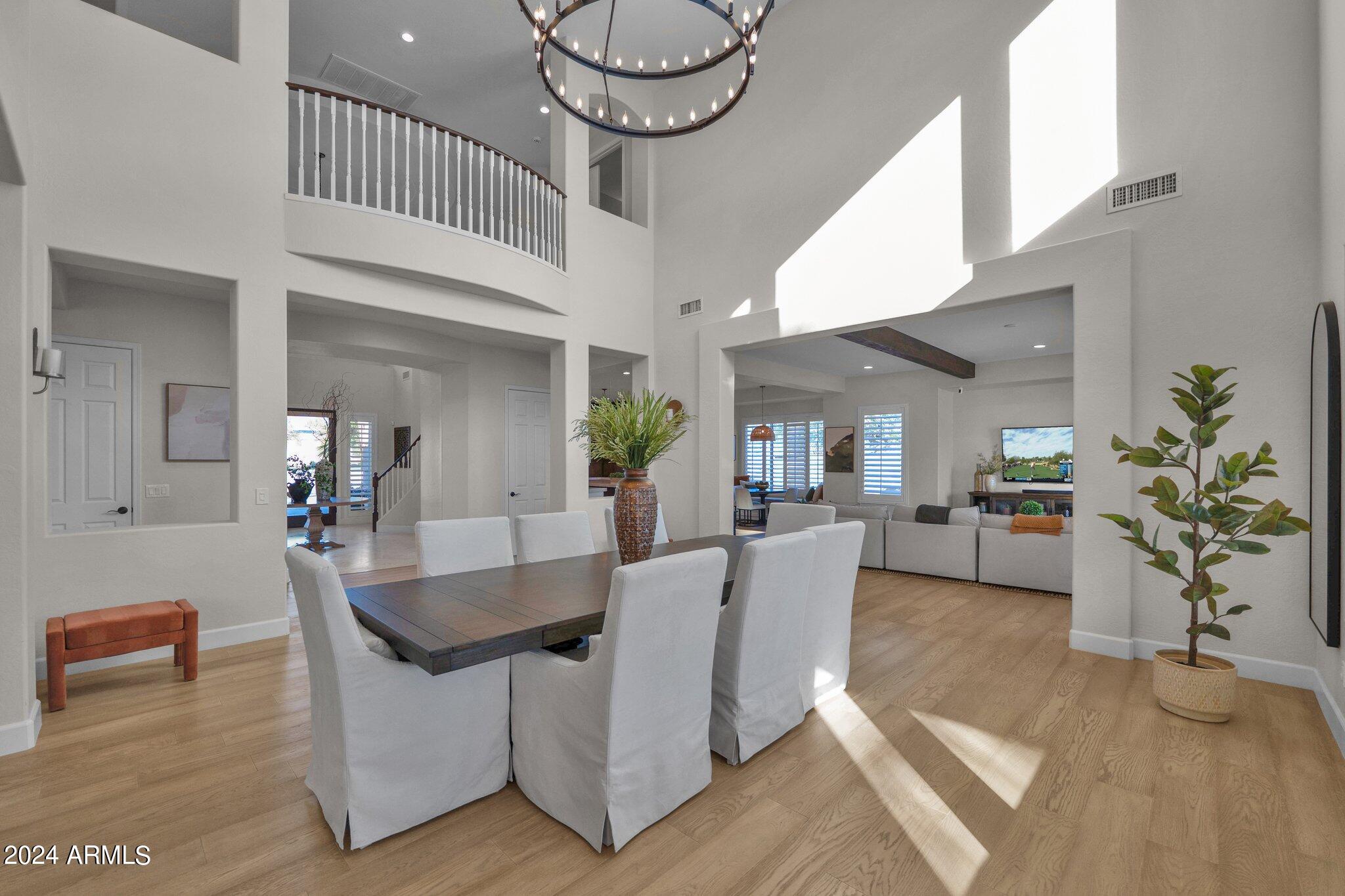 2517 South Constellation Way Gilbert, AZ 85295 - Photo 21 of 105 a view of a dining room with furniture and a chandelier