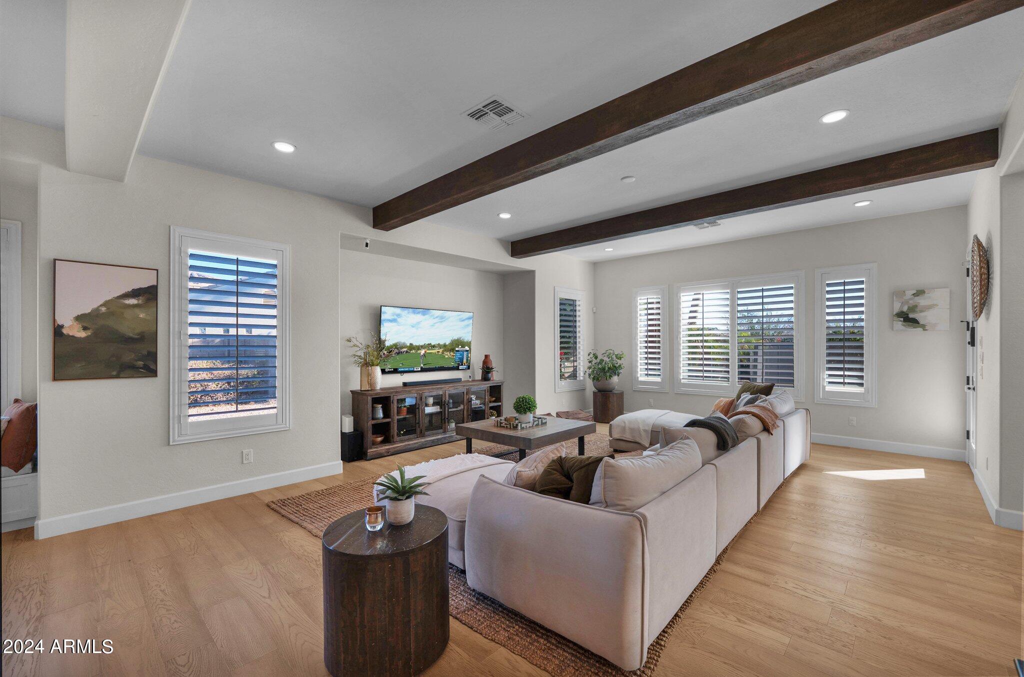 2517 South Constellation Way Gilbert, AZ 85295 - Photo 25 of 105 a living room with fireplace furniture and a flat screen tv