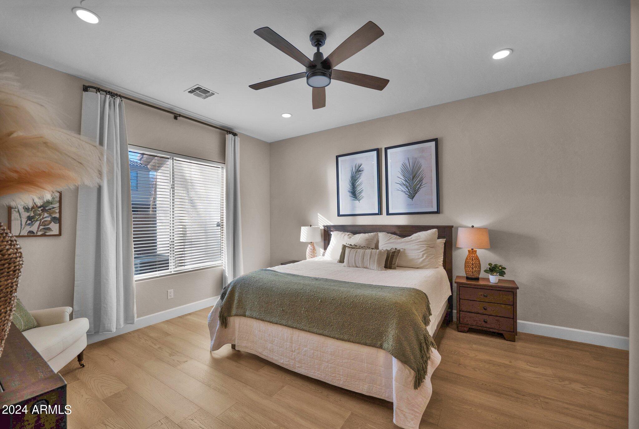 2517 South Constellation Way Gilbert, AZ 85295 - Photo 35 of 105 a bedroom with a large bed and a large window