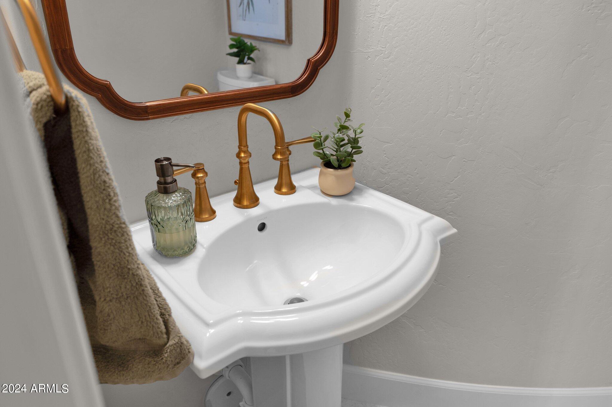 2517 South Constellation Way Gilbert, AZ 85295 - Photo 40 of 105 a bathroom with a sink and mirror