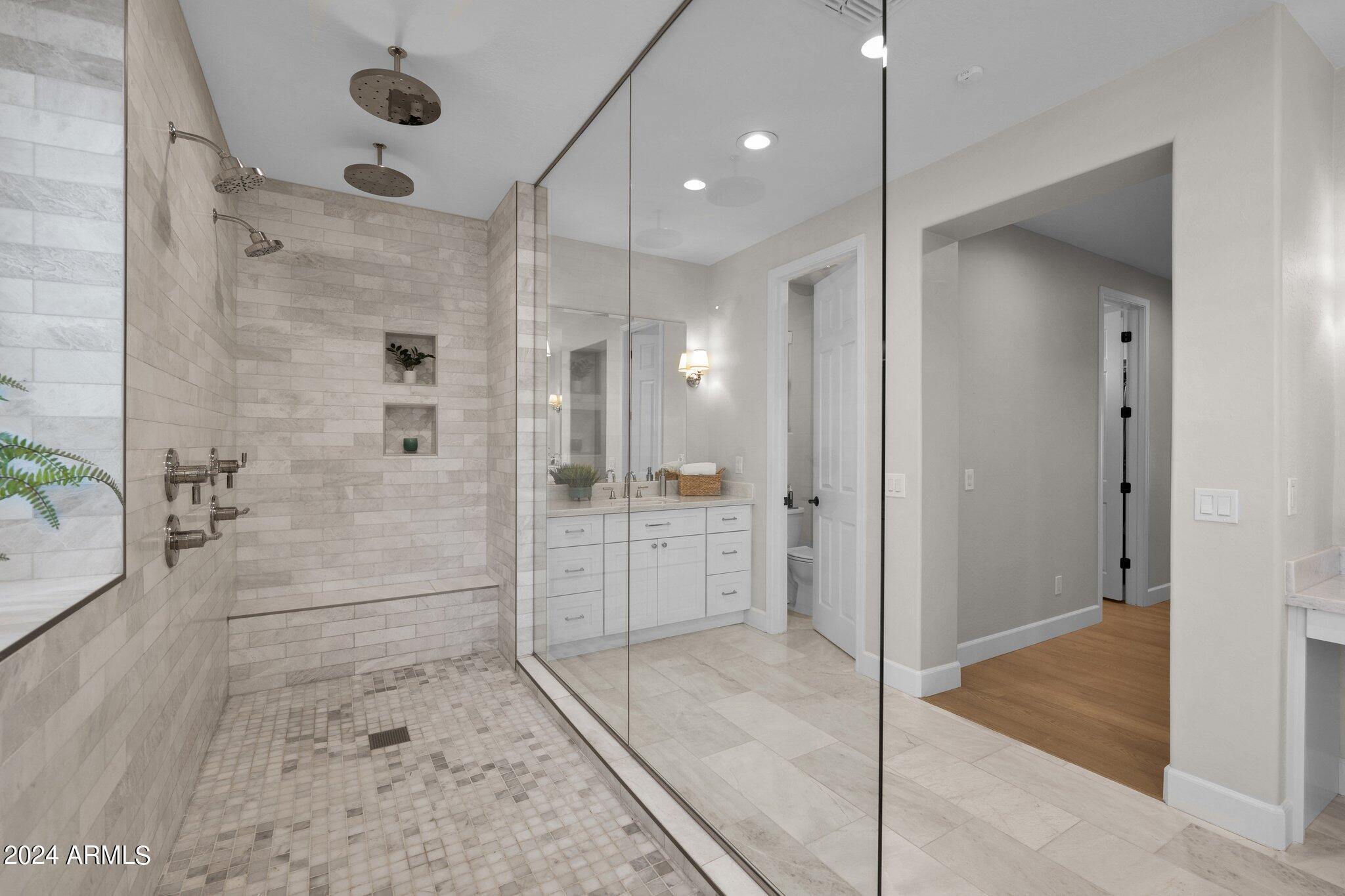 2517 South Constellation Way Gilbert, AZ 85295 - Photo 50 of 105 a bathroom with a glass shower door and a glass door shower