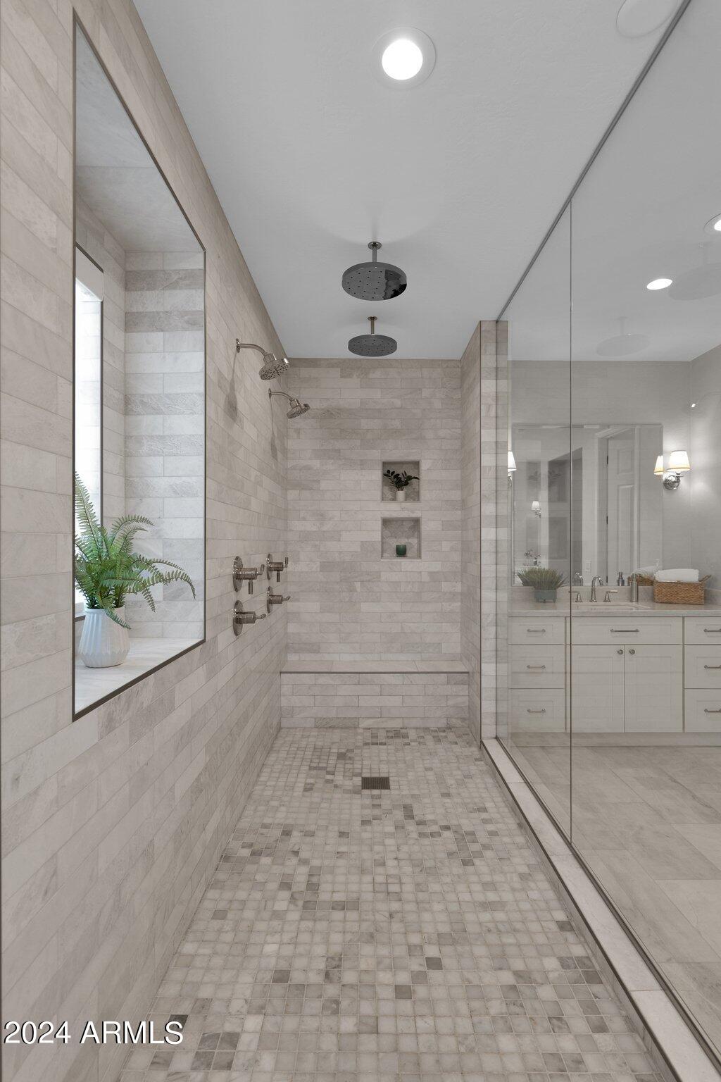 2517 South Constellation Way Gilbert, AZ 85295 - Photo 51 of 105 a bathroom with a glass shower door and a glass door