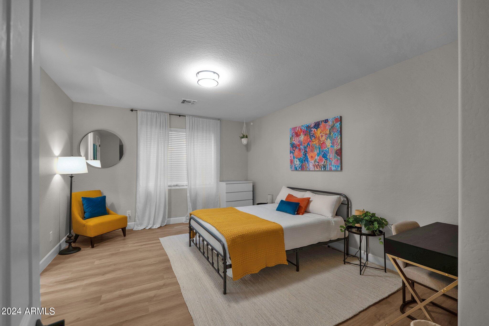 2517 South Constellation Way Gilbert, AZ 85295 - Photo 63 of 105 a bedroom with bed and a large window