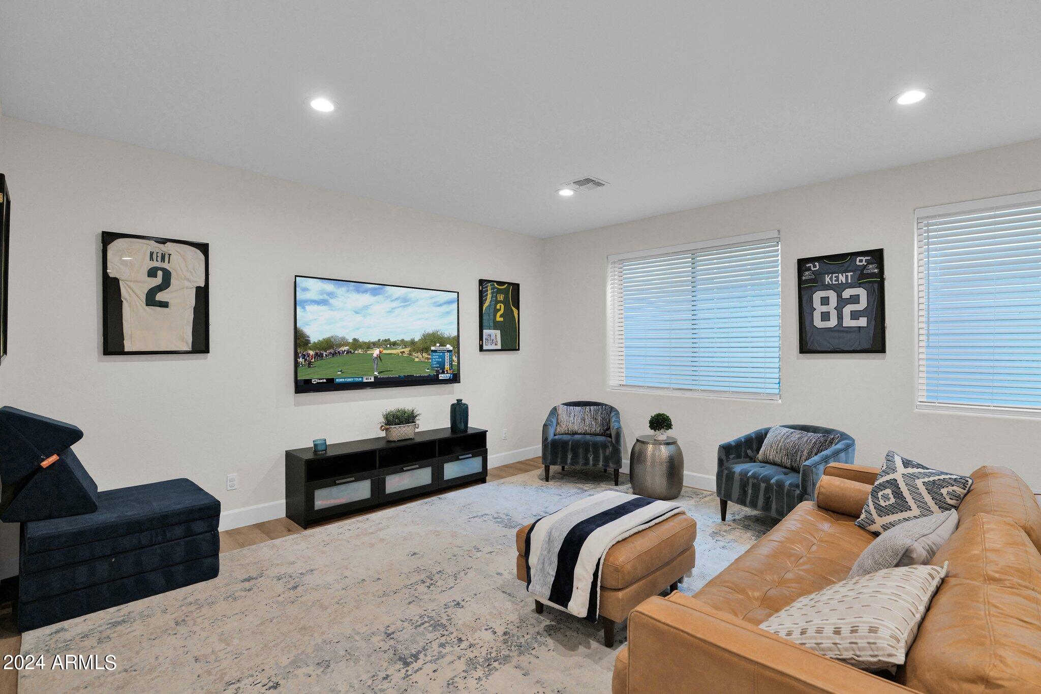 2517 South Constellation Way Gilbert, AZ 85295 - Photo 68 of 105 a living room with furniture and a flat screen tv