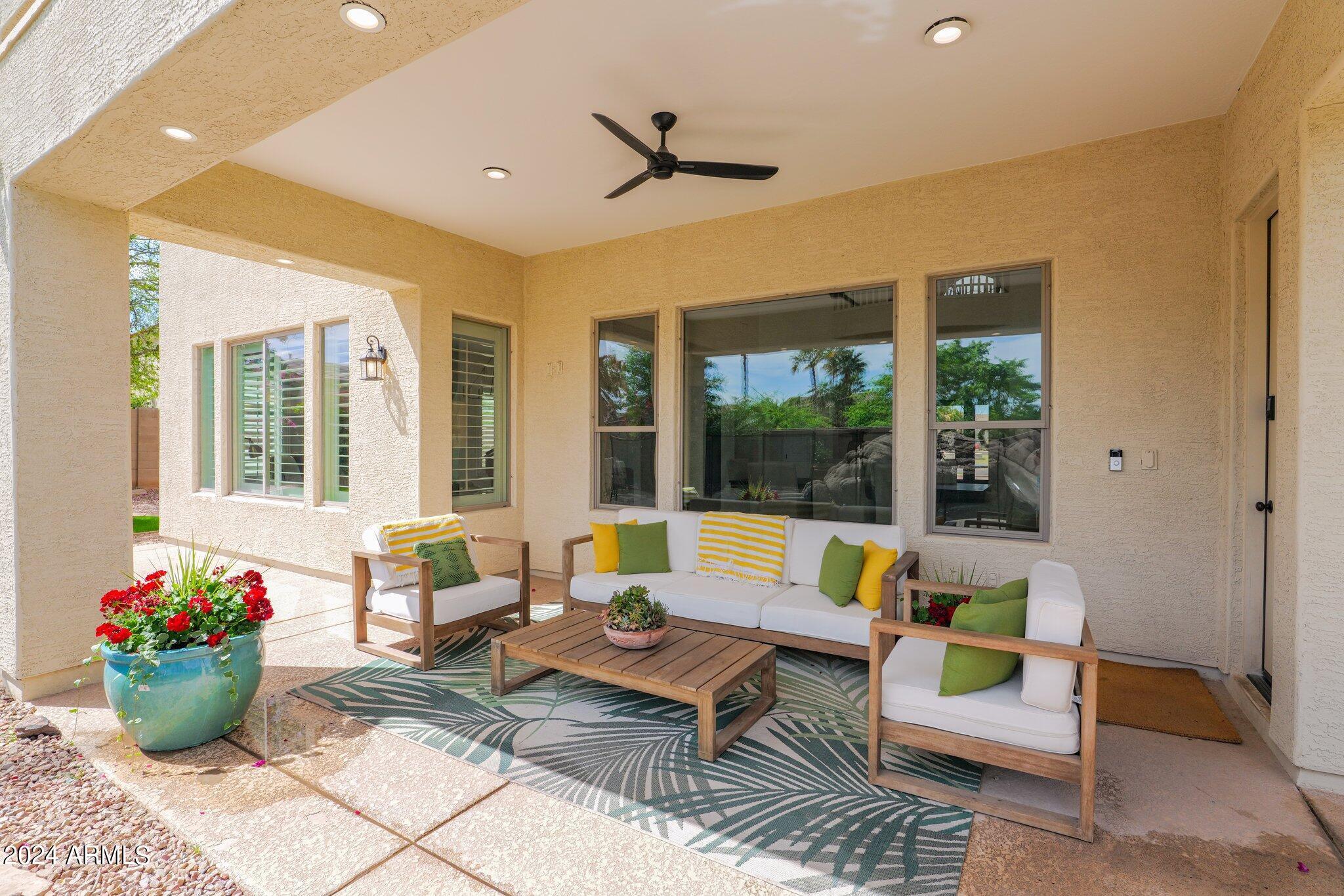 2517 South Constellation Way Gilbert, AZ 85295 - Photo 81 of 105 a living room with patio furniture and a potted plant