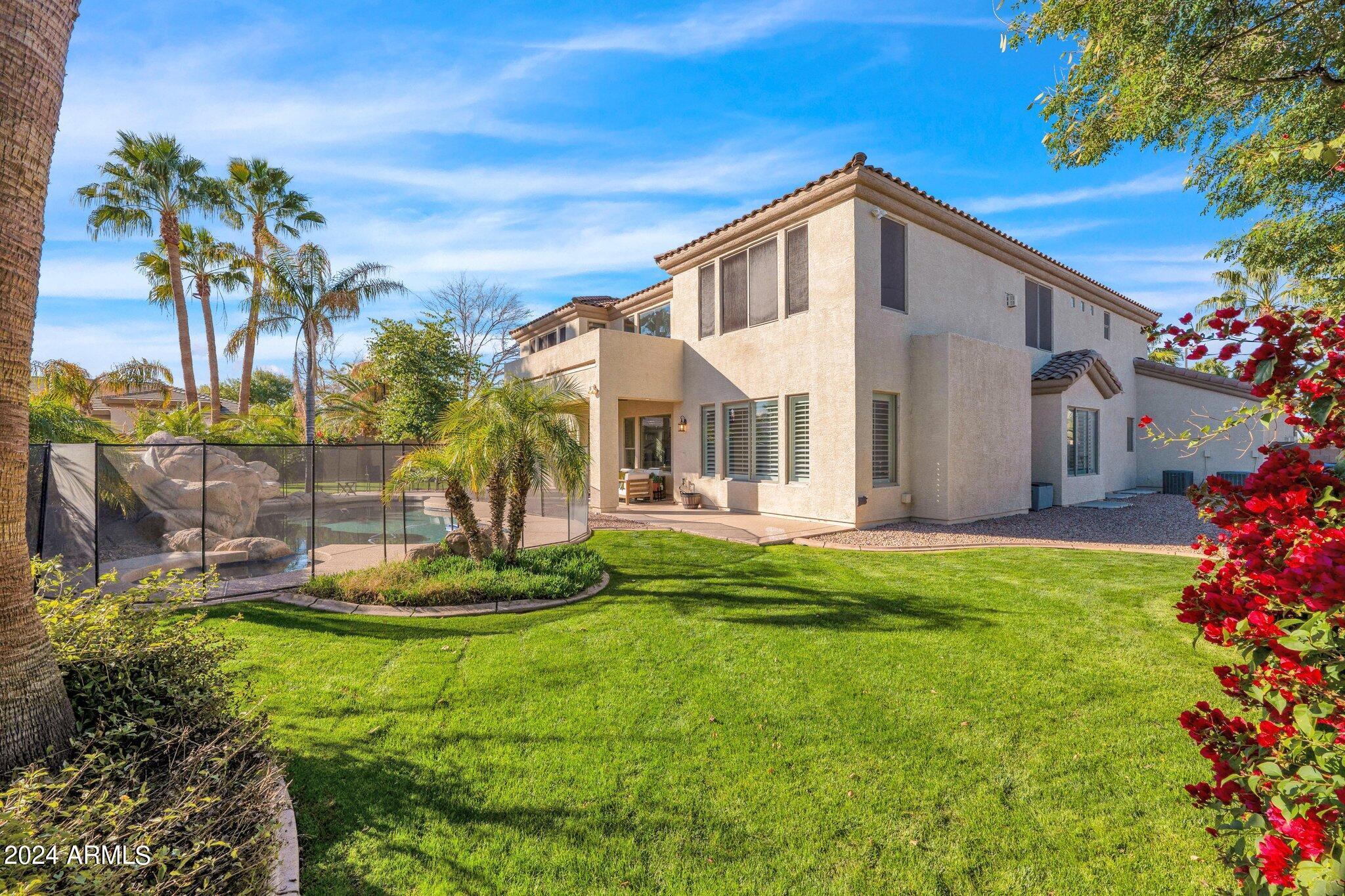 2517 South Constellation Way Gilbert, AZ 85295 - Photo 84 of 105 a front view of a house with a yard