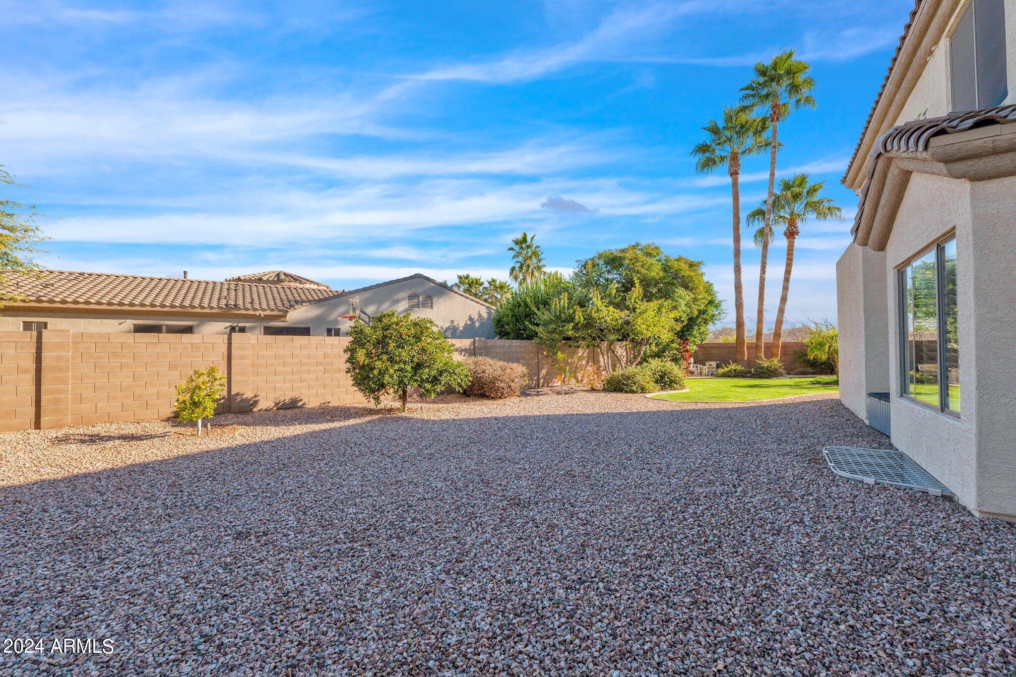 2517 South Constellation Way Gilbert, AZ 85295 - Photo 88 of 105 a view of a house with a yard and a garage