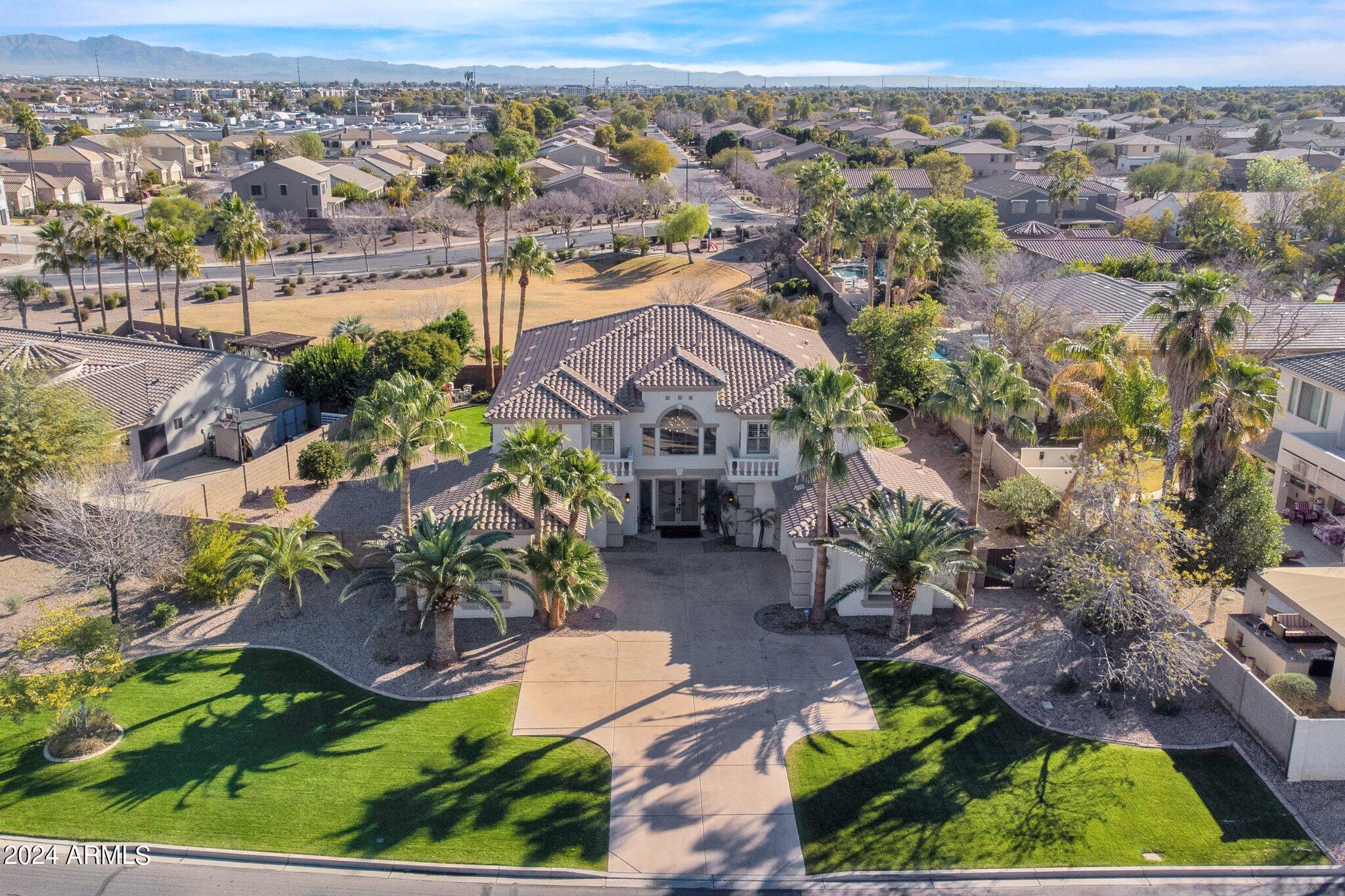 2517 South Constellation Way Gilbert, AZ 85295 - Photo 90 of 105 an aerial view of a house with a yard and lake view
