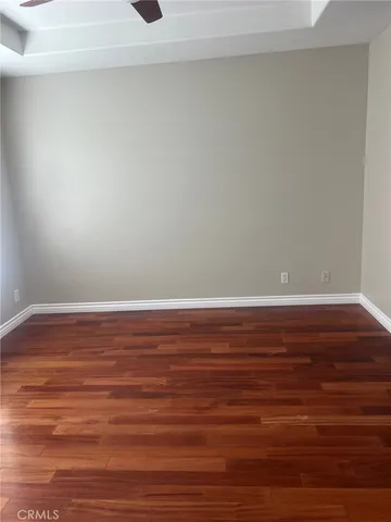 a view of room and wooden floor