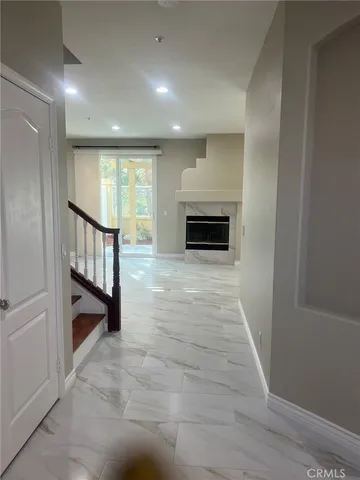 a view of a hallway with seating space