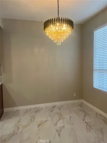 a view of kitchen and chandelier